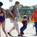 New York resident Sarah Rentz, is tugged by her three-year-old son Avery Vinas, dressed as Spiderman, while they hang outside of the Washtenaw Interclub Swim Conference championships at Skyline High School on Thursday, July 25, 2013. Melanie Maxwell | AnnArbor.com